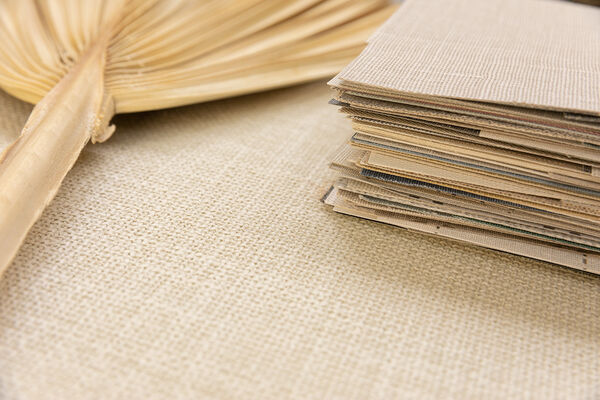 stack of textile wallcovering designs
