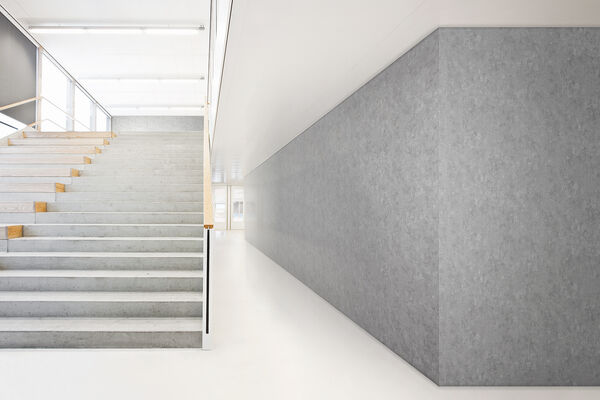 gray vinyl wallcovering applied on a wall next to staircase