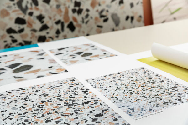 customized digital printed wallcovering samples spread out over a table