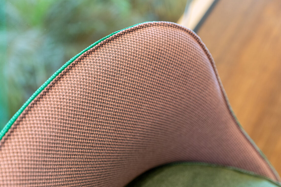 close up of a upholstered chair backrest