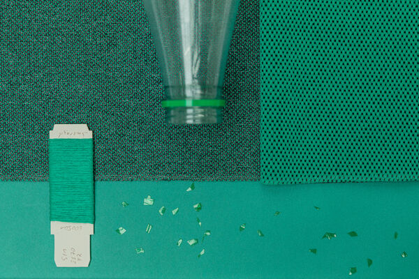 green moodbaord showing the process of plastic waste turning into upholstery fabrics