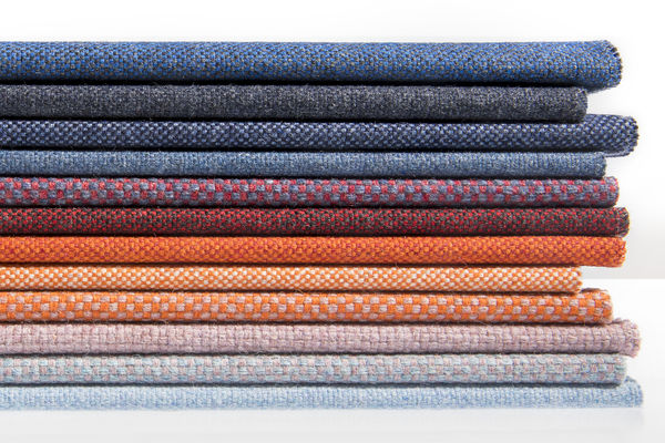 Stack of various upholstery fabrics